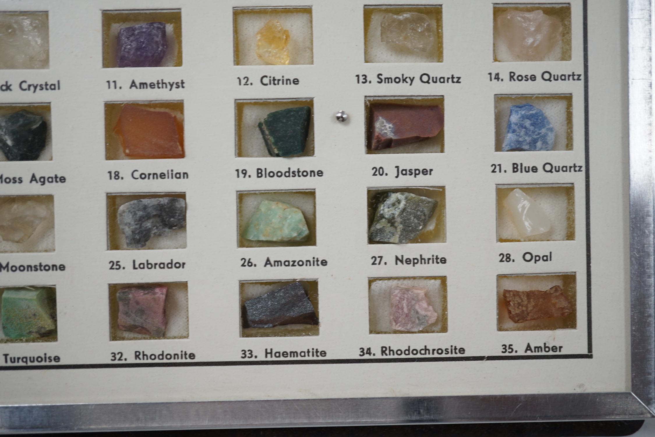 A small presentation booklet containing thirty five natural precious stones.